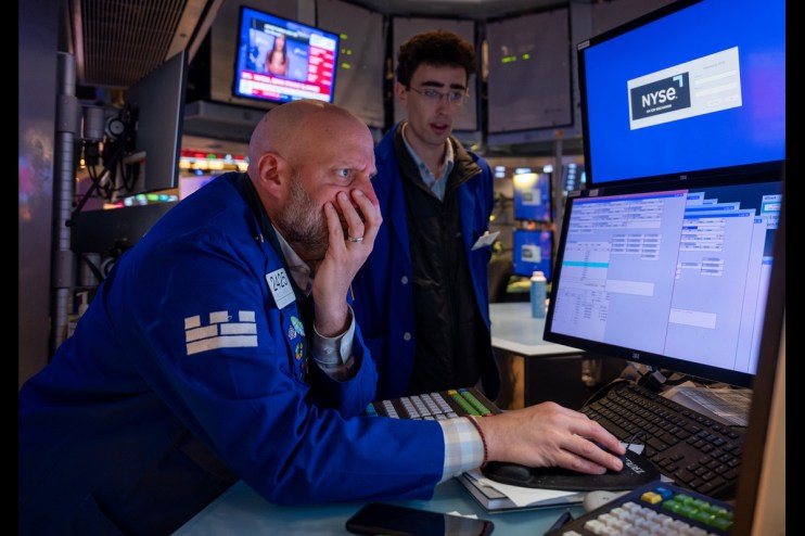 Traders work on the floor of the New York Stock Exchange after the US stockmarket fell (Photo by Spencer Platt/Getty Images)