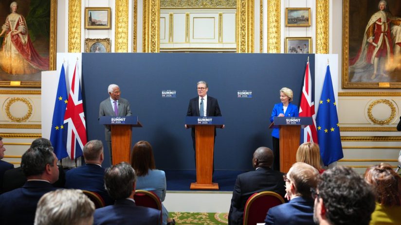LONDON, ENGLAND - MAY 19: European Council President Antonio Costa (L) and European Commission, Ursula von der Leyen (R) look on as UK Prime Minister Keir Starmer (C) speaks during a press conference at the UK-EU summit at Lancaster House on May 19, 2025 in London, England. Prime Minister Keir Starmer is hosting leaders from the European Union for the first UK-EU Summit since Britain's withdrawal from the EU in January 2020, to discuss plans for resetting the UK's relationship with the bloc. The Labour government has said it will deliver a stronger partnership with the EU, "strengthening our alliances and closing deals in the interests of British people." According to the European Council, the meeting will also be an opportunity for the leaders to reaffirm a joint commitment to peace and security in Europe. (Photo by Carl Court/Getty Images)