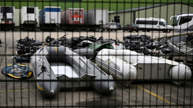 Inflatable dinghies and engines used by migrants to cross the English Channel from France, pictured in Dover.