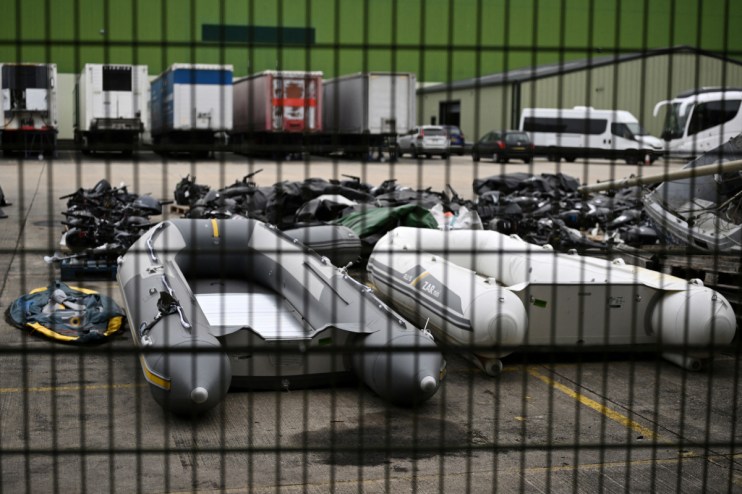Inflatable dinghies and engines used by migrants to cross the English Channel from France, pictured in Dover.