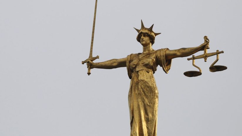 LONDON, ENGLAND - FEBRUARY 16: A statue of the scales of justice stands above the Old Bailey on February 16, 2015 in London, England. (Photo by Dan Kitwood/Getty Images)
