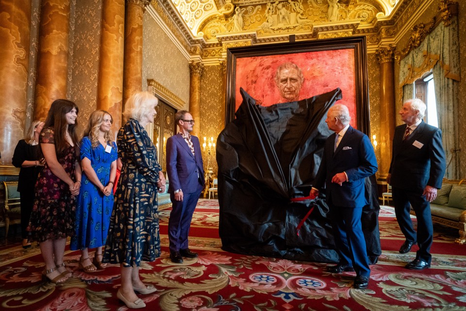 Jonathan Yeo watches on as King Charles unveils his iconic painting