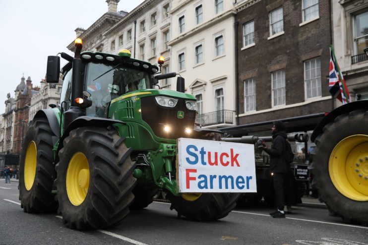 A tractor, carrying the message "Stuck Farmer", drives in Westminster during a Farmers Protest on February 10, 2025 in London, England. Demonstrators gather in central London to protest against changes to inheritance tax rules for land ownership for farmers. (Photo by Alishia Abodunde/Getty Images)
