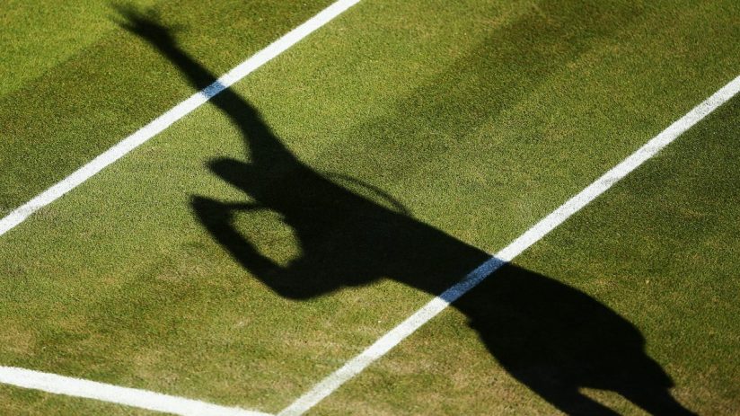 LONDON, ENGLAND - JUNE 27: A detail shot of a shadow of a tennis player serving on day five of the Wimbledon Lawn Tennis Championships at the All England Lawn Tennis and Croquet Club on June 27, 2014 in London, England. (Photo by Dan Kitwood/Getty Images)