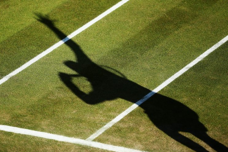 LONDON, ENGLAND - JUNE 27: A detail shot of a shadow of a tennis player serving on day five of the Wimbledon Lawn Tennis Championships at the All England Lawn Tennis and Croquet Club on June 27, 2014 in London, England. (Photo by Dan Kitwood/Getty Images)