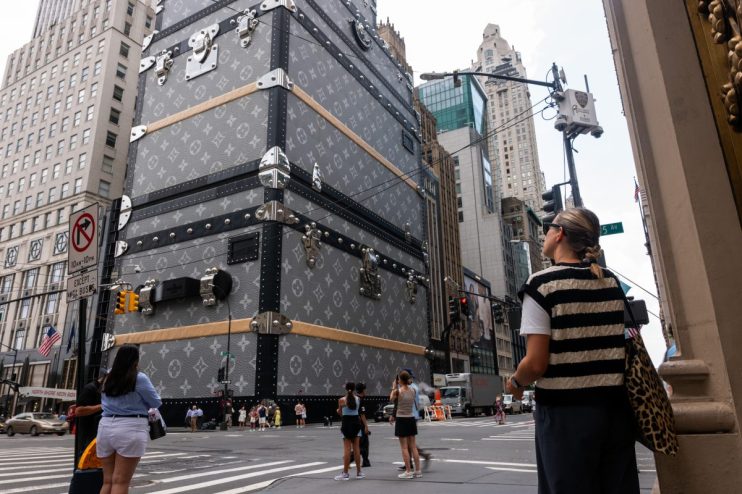 NEW YORK, NEW YORK - JULY 14: The 19-story fa&ccedil;ade of the Louis Vuitton luxury store, which is closed for renovations, stands wrapped in a design reminiscent of their monogrammed trunks in Manhattan on July 14, 2025, in New York City. Weeks after Democratic socialist candidate Zohran Mamdani won the Democratic primary for mayor of New York City, various wealthy interest groups have begun to mobilize against the 33-year-old state assemblyman. Mamdani has vowed to freeze rent hikes for a year, make buses free, and increase taxes on wealthy New Yorkers. Former Gov. Andrew Cuomo announced that he will continue his run as a third-party candidate for New York City mayor after losing to Zohran Mamdani in last month's Democratic primary. (Photo by Spencer Platt/Getty Images)