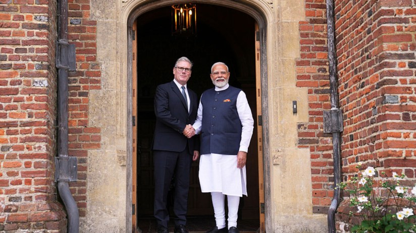 Keir Starmer and Narendra Modi shaking hands outside outside the Prime Minister's grace and favour mansion, Chequers, before signing the trade deal (Photo by Kin Cheung - WPA Pool/Getty Images)