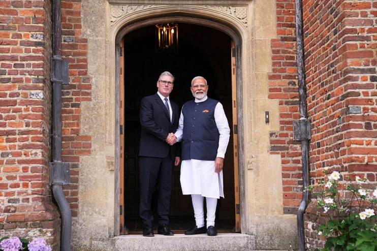 Keir Starmer and Narendra Modi shaking hands outside outside the Prime Minister's grace and favour mansion, Chequers, before signing the trade deal (Photo by Kin Cheung - WPA Pool/Getty Images)
