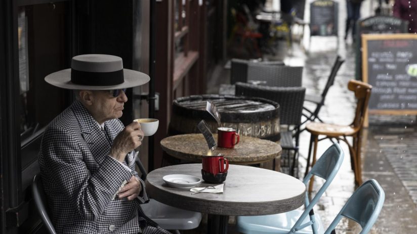 LONDON, UNITED KINGDOM - MAY 17: A man drinks a coffee at a cafe in Soho on May 17, 2021 in London, United Kingdom. From today, covid restrictions on indoor activities and household mixing ease across most of the UK, with indoor food and entertainment venues allowed to reopen across England and Wales, and small in-home meetings permitted once again in England and Scotland. Hugging is also once again allowed between close family and friends across the UK, except in Northern Ireland, where they remain in place until at least May 24. (Photo by Dan Kitwood/Getty Images)