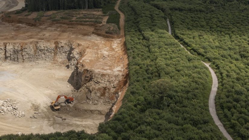 EAST MALLING, UNITED KINGDOM - JULY 06: An aerial view of the Oaken Wood and Hermitage Quarry on July 06, 2023 in East Malling, United Kingdom. Oaken Wood in Kent is a 'Plantation of Ancient Woodland Site', (PAWS), ancient woodland that has been felled and replanted. The woodland is currently under threat from a local quarry run by Gallagher Aggregates Ltd, excavating Kent Ragstone, which is used in construction for restoring old buildings. It is feared that the expansion could lead to the loss of a around 50 hectares of 'precious habitat', home to a wide range of wildlife including dormice, reptiles, butterflies and bats. The woodland lost around 32 hectares, due to the quarries to expansion, in 2013. The Woodland Trust have begun a campaign which has generated more than 7,000 letters of objection. (Photo by Dan Kitwood/Getty Images)