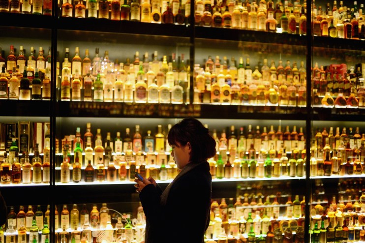 MARCH 19: Members of the public view the Diageo Claive Vidiz Collection, the world's largest collection of Scottish Whisky on display at The Scotch Whisky Experience on March 19, 2014 in Edinburgh, Scotland.(Photo by Jeff J Mitchell/Getty Images)
