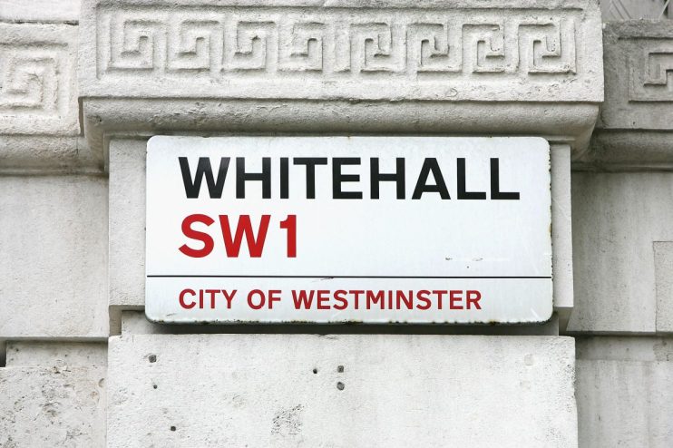 LONDON-SEPTEMBER 17: LONDON-SEPTEMBER 17: The street sign for Whitehall sits on a building across from Britain's Houses of Parliament on September 17, 2004 in London, England. (Photo by Scott Barbour/Getty Images)