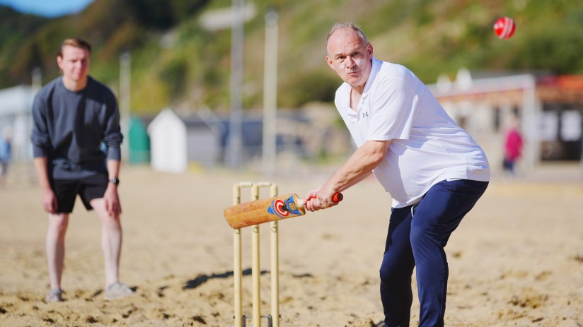 Lib Dem leader Ed Davey plays a spot of beach cricket