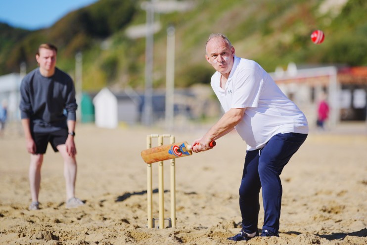 Lib Dem leader Ed Davey plays a spot of beach cricket
