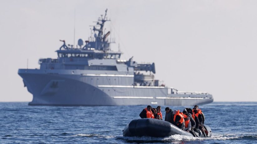 ENGLISH CHANNEL - MARCH 06: An inflatable dinghy carrying migrants is escorted by a French Warship across the English Channel towards British Waters on March 06, 2024 in the English Channel. According to official figures 401 migrants arrived in the UK by small boat on Monday, the busiest day of the year so far for Channel crossings. This brings the provisional total number of UK arrivals so far this year to 2,983. Government data indicates this is more than the 2,953 logged this time last year and surpasses the running totals documented between January 1 and March 4 each year since current records began in 2018. (Photo by Dan Kitwood/Getty Images) (Photo by Dan Kitwood/Getty Images)