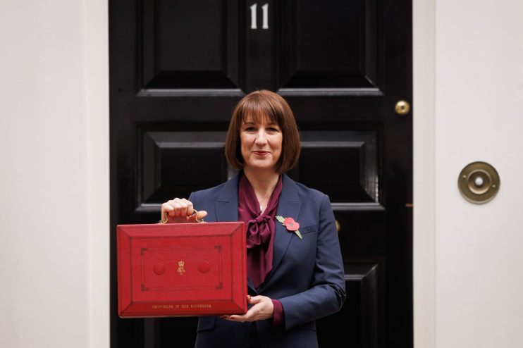 LONDON, ENGLAND - OCTOBER 30: Chancellor Rachel Reeves poses with the red box outside number 11 Downing Street on October 30, 2024 in London, England. This is the first Budget presented by the new Labour government and Chancellor of the Exchequer, Rachel Reeves. (Photo by Dan Kitwood/Getty Images)