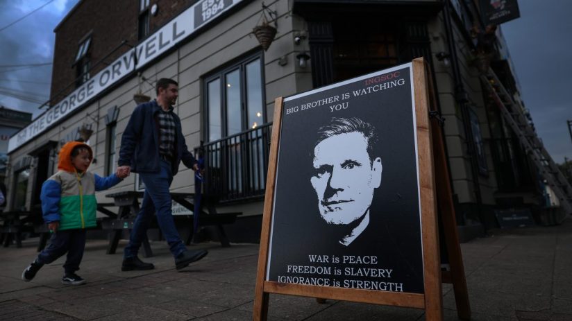 LIVERPOOL, ENGLAND - SEPTEMBER 27:A poster is seen of Britain's Prime Minister Keir Starmer at The Two helmets pub in New Brighton in protest against Labours digital ID policy on September 27, 2025 in Liverpool, England. (Photo by Jeff J Mitchell/Getty Images)