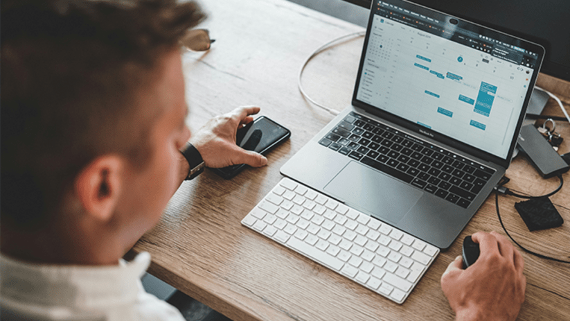 Executive balancing MBA studies with full-time job at Bayes Business School, illustrating career advancement and education