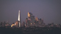 Canada skyline with modern skyscrapers under a clear blue sky, showcasing iconic financial district architecture