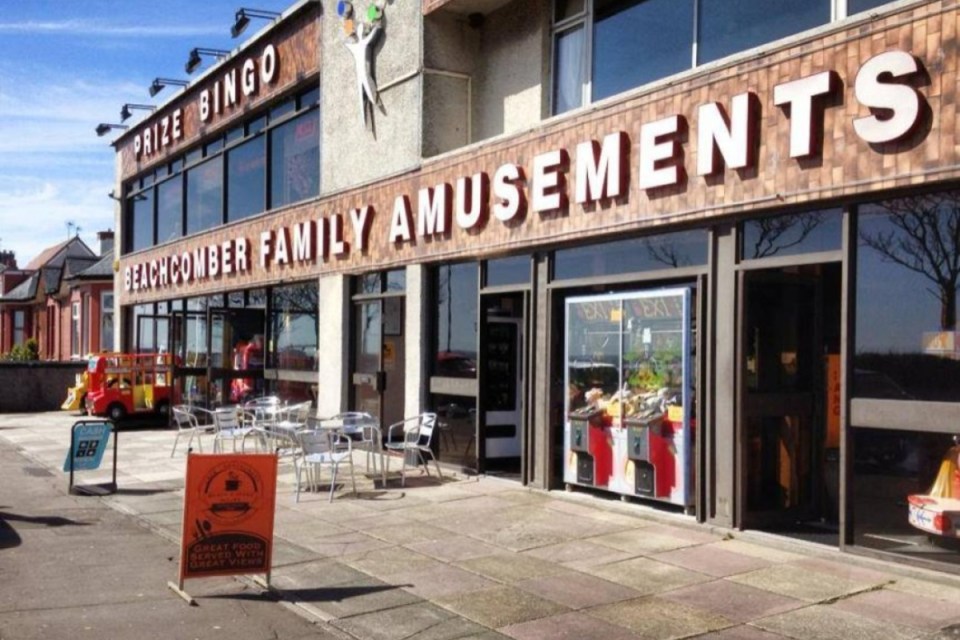 Small business owners protesting rising energy costs outside Beachcomber Amusements in Fife amidst subsidy concerns