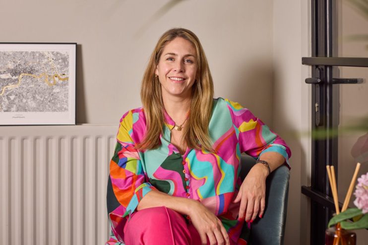 Alex Head, CEO and founder of Social Pantry, smiling confidently in a business suit.