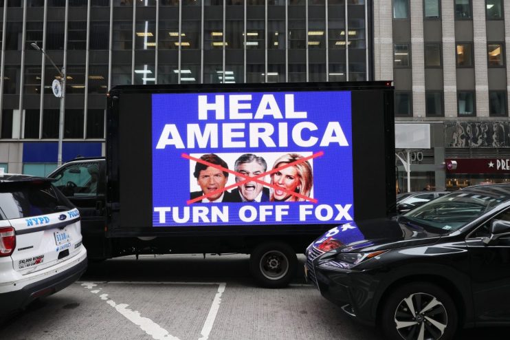 NEW YORK, NEW YORK - FEBRUARY 21: A video truck displays a message as members of Rise and Resist participate in their weekly "Truth Tuesday" protest at News Corp headquarters on February 21, 2023 in New York City. Text messages and emails between various Fox News hosts and network executives obtained during a defamation lawsuit brought by voting machine company Dominion against Fox News were released last week. They show that company employees had a much different view of election fraud than what was being broadcast on air in order not to lose viewers who supported then-President Donald Trump. (Photo by Michael M. Santiago/Getty Images)