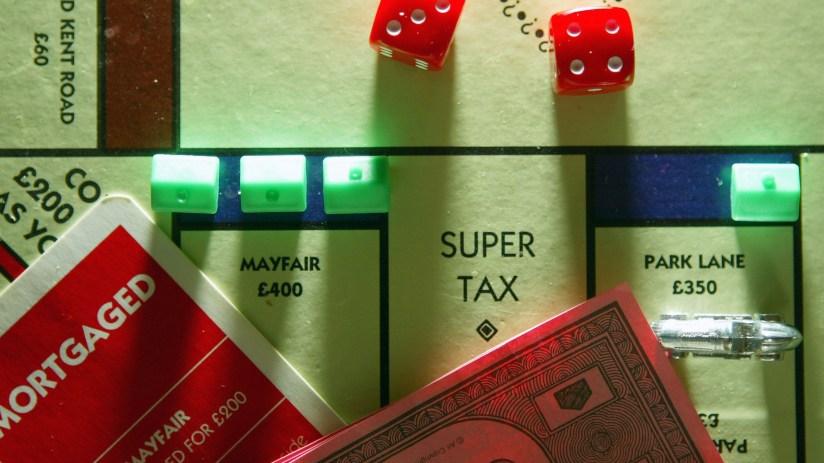 Monopoly board showing homes and tax