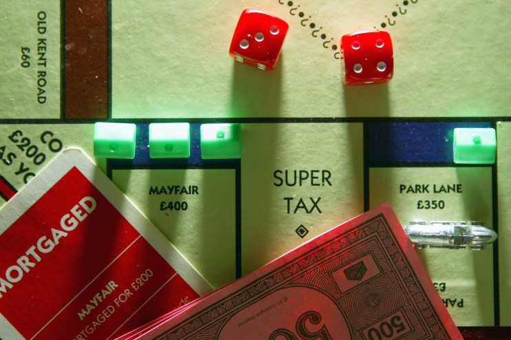 Monopoly board showing homes and tax