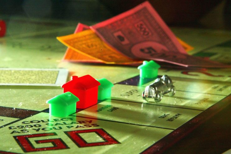 Houses adorn a famous London street on a Monopoly board (Photo Illustration by Christopher Furlong/Getty Images)