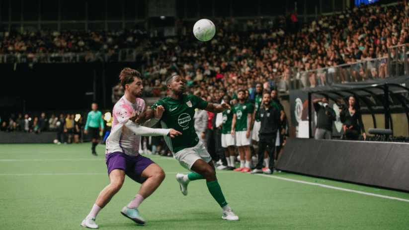 O2 Arena hosting a thrilling game event with vibrant lights and enthusiastic crowd cheering in the packed stands