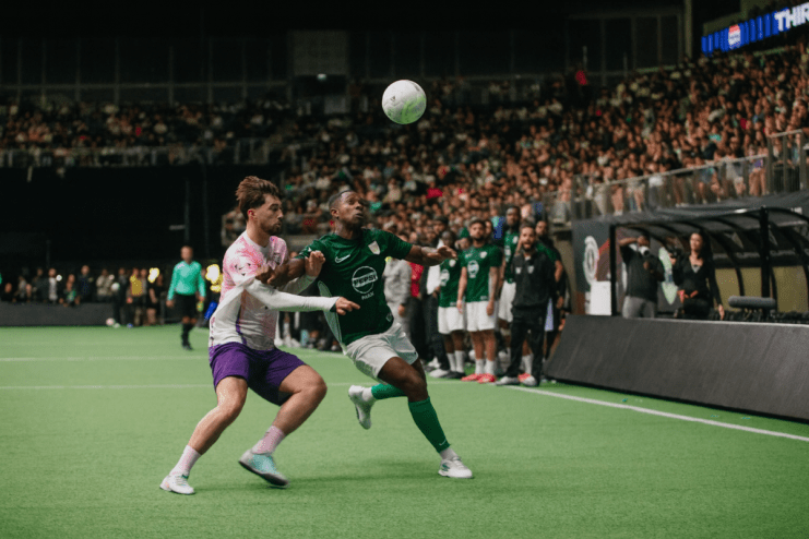 O2 Arena hosting a thrilling game event with vibrant lights and enthusiastic crowd cheering in the packed stands