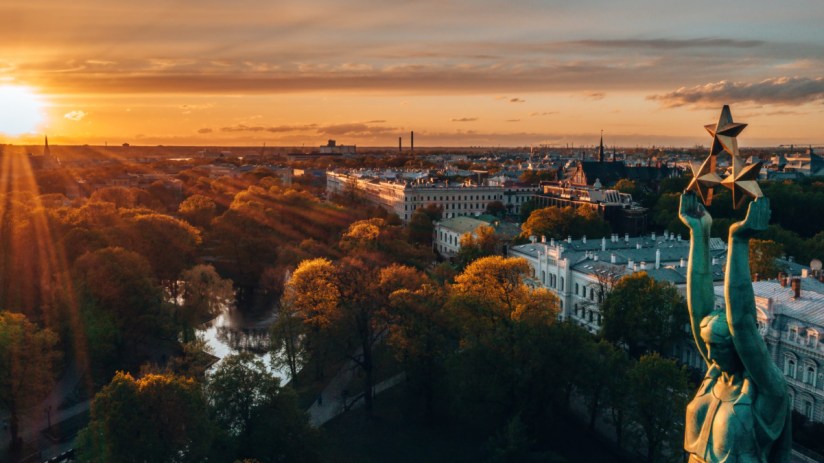 Riga cityscape featuring historic architecture, scenic skyline, and vibrant urban landscape under a clear blue sky