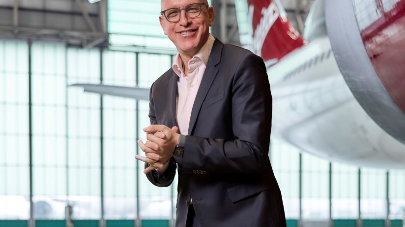 Shai Weiss at a 2025 event, photographed by Adam Gerard, wearing a suit and speaking on future business strategies