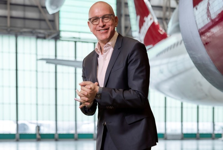 Shai Weiss at a 2025 event, photographed by Adam Gerard, wearing a suit and speaking on future business strategies
