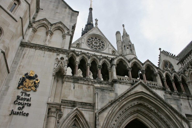 The Royal Courts of Justice building with its gothic architecture and iconic facade in London on a bright day