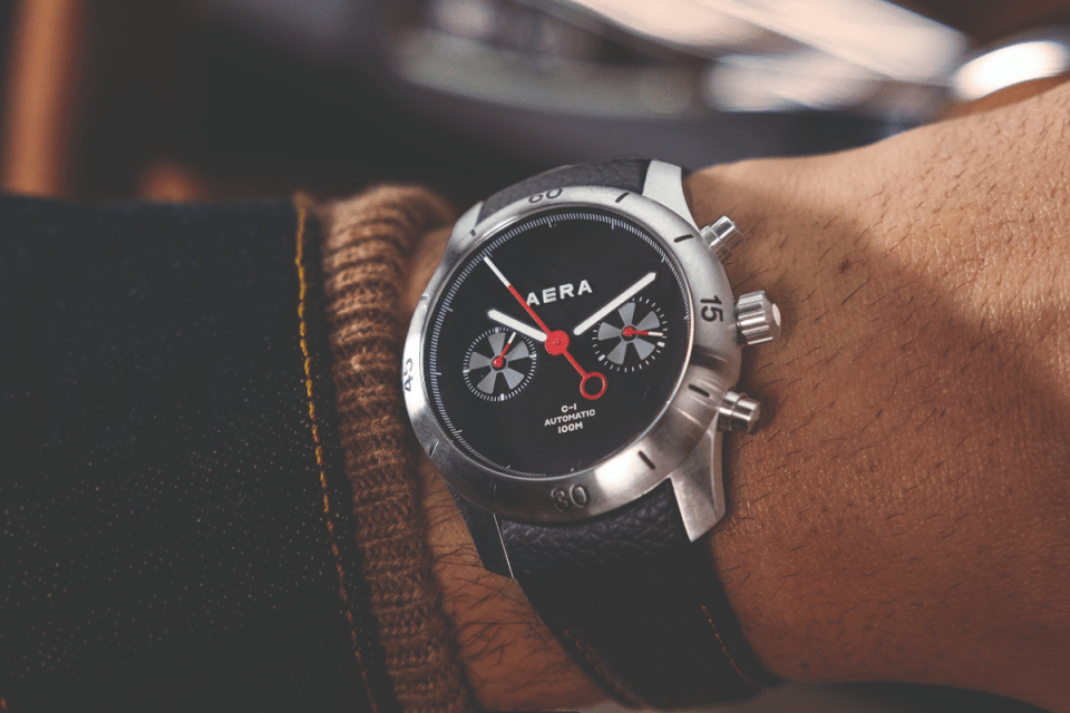Luxury car dashboard with precision-engineered watch integrated, symbolizing collaboration between automotive and horology...