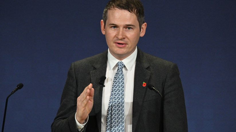 Ian Hogarth in a business setting, highlighting his role in the news, with neutral background and professional attire.