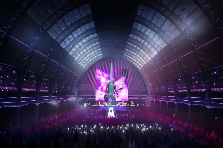 Olympia Grand Concert stage with vibrant lights and audience, featuring a live performance in a large indoor venue