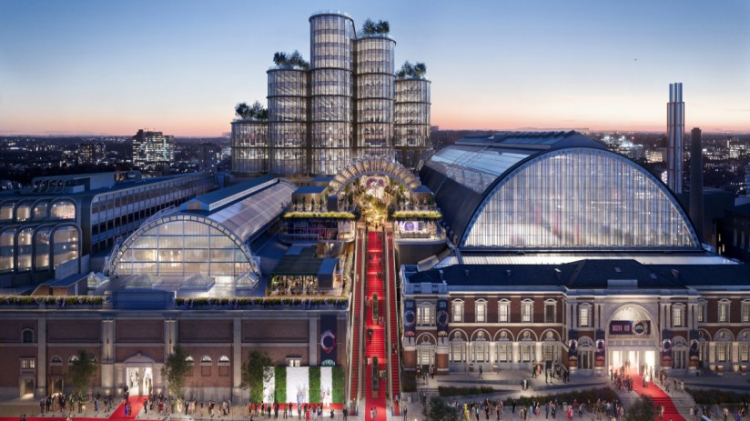 Elegant red carpet event on Olympia Way showcasing celebrity arrivals and glamorous fashion in a bustling evening atmosphere.