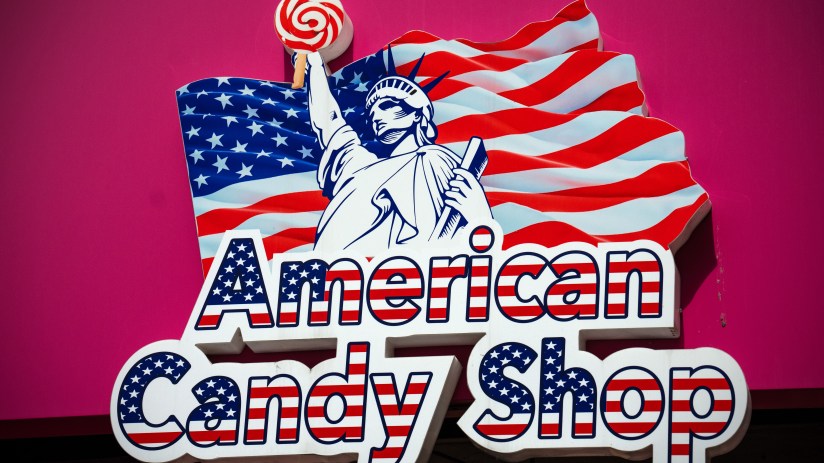 Colorful assortment of American candy displayed in a store, showcasing popular brands and vibrant packaging in a retail se...