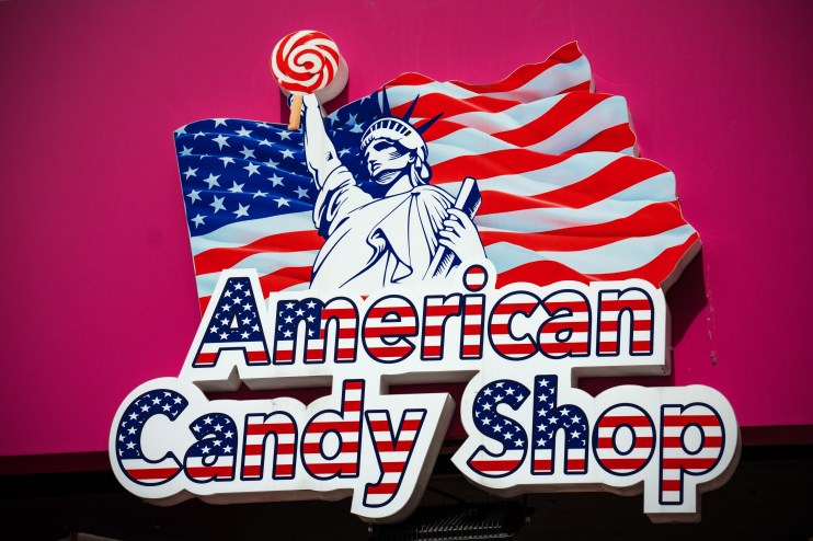 Colorful assortment of American candy displayed in a store, showcasing popular brands and vibrant packaging in a retail se...