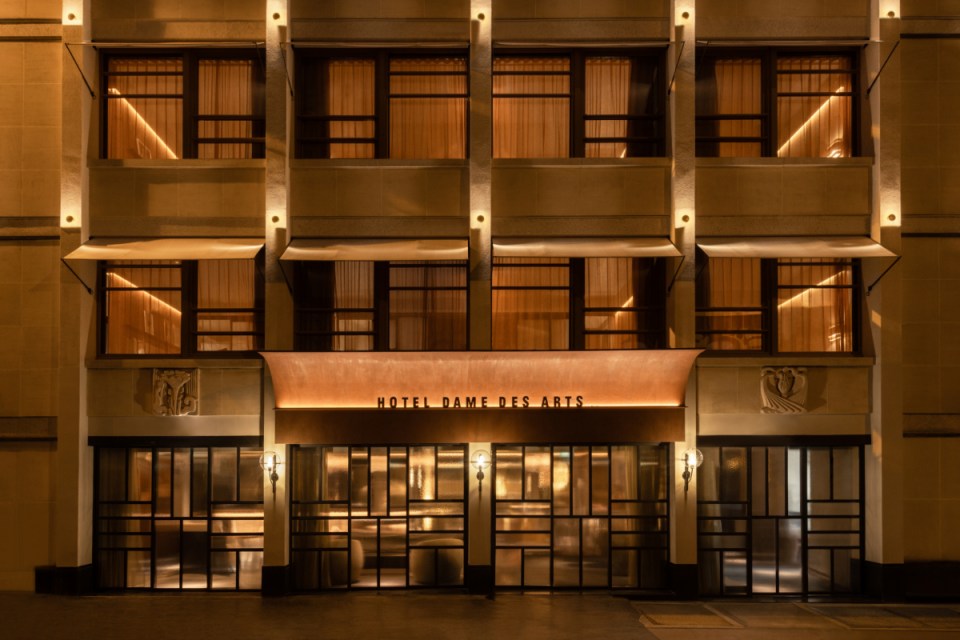Hotel Dame Des Arts exterior view showcasing elegant architecture, Parisian charm, and bustling city ambience, credit Ludo...