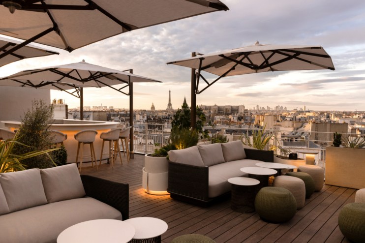 Hotel Dame Des Arts exterior with elegant architecture, vibrant Parisian street, credit Ludovic Balay