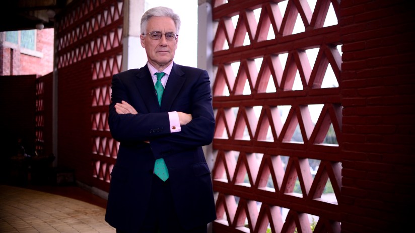 Lord Adair Turner speaking at a conference, focused on economic policy and financial regulation insights.