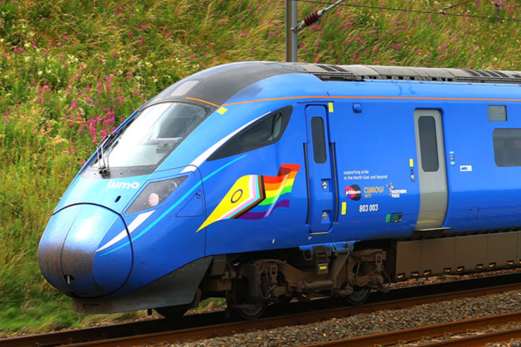 Lumo train speeding through scenic countryside, highlighting sustainable travel options and modern rail technology