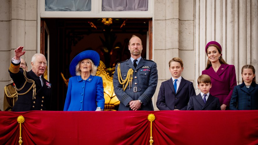 Royal Family members waving from balcony during public appearance at historical event in London