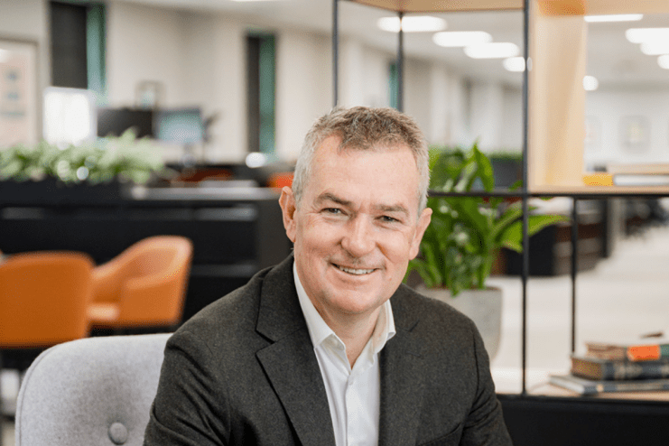 Simon Emeny, CEO of Fullers, delivers a keynote speech at a business conference, emphasizing leadership and industry insig...