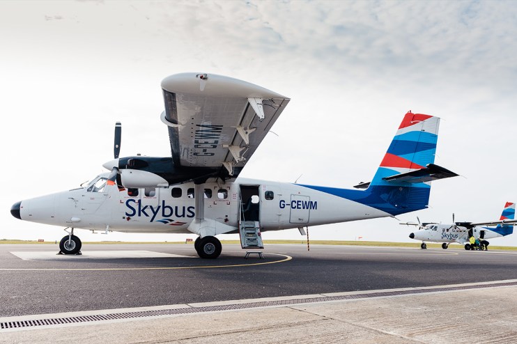 Skybus aircraft showcasing sleek design and modern technology against a clear sky in a business news context