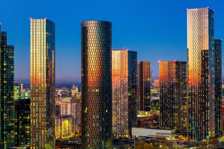 Manchester skyline with iconic landmarks during a Belfast speech event, highlighting urban landscape and architectural bea...