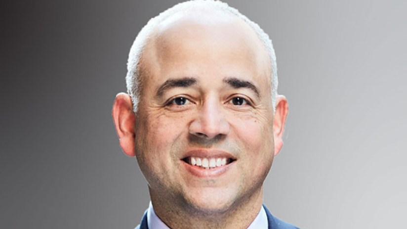 Jose Minaya presenting at a business event, engaging audience with innovative ideas and strategies, professional setting v...